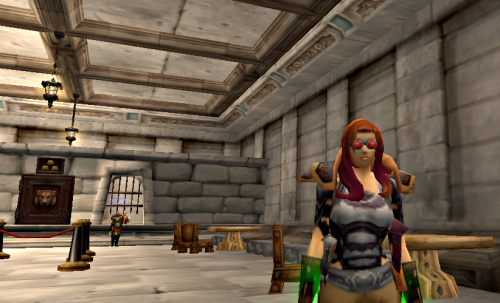 Checking in on her Guild Bank, Waylan pauses at the Stormwind Bank